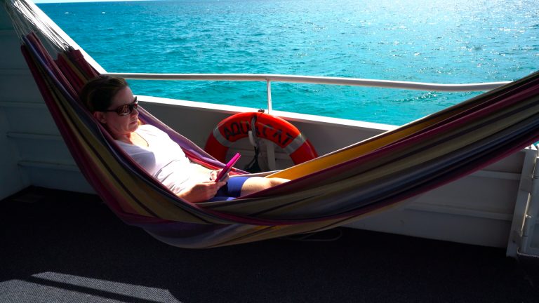 Relax in the hammock aboard Aqua Cat Bahamas dive liveaboard